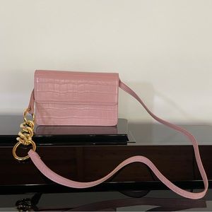 JW PEI Pink Vegan Alligator Skin Purse with Gold Chain Detail on the Strap.